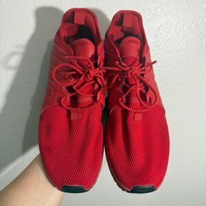 Men’s all red adidas shoes see stain on right shoe
